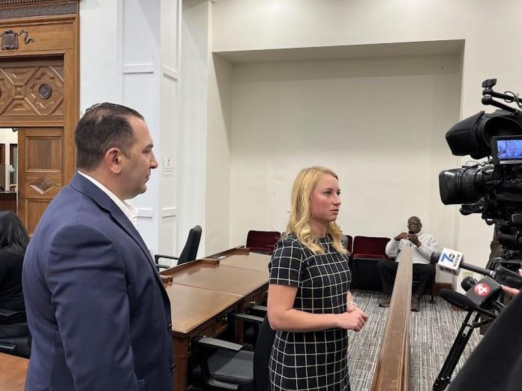 Legislators Lindsay Lorigo and Frank Todaro speaking with reporters from local news stations