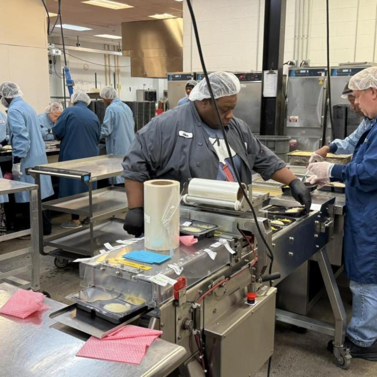Legislator Lorigo Tours FeedMore WNY's commissary and warehouse