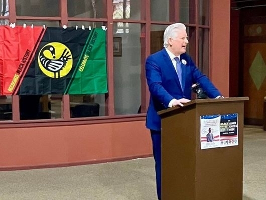 Clerk Mickey Kearns speaking at King Urban Life Center during the Black History at the White House event, with a focus on community and youth support initiatives.