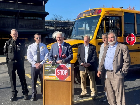 Erie County Clerk Michael P. Kearns and Community Partners support National School Bus Safety Week reminding drivers to stop when they see the flashing red lights of a yellow school bus.