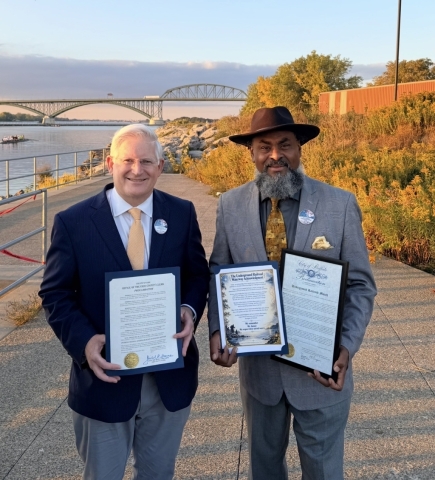 Erie County Clerk Michael P. “Mickey” Kearns presents a proclamation to DeWitt Lee III, Chairman of the U.S./Canadian Underground Railroad Committee and community advocate with Care Takers of Our Culture, recognizing Underground Railroad Month during the Peace Bridge lighting in honor of North Star Day.