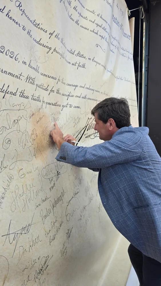 Mark Poloncarz signing the Declaration of Independence