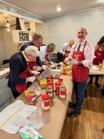 Legislator Greene helps the United Way make peanut butter and jelly sandwiches for Friends of the Night People