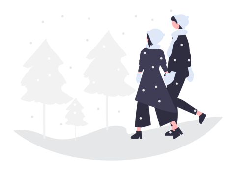 two people walking in the snow