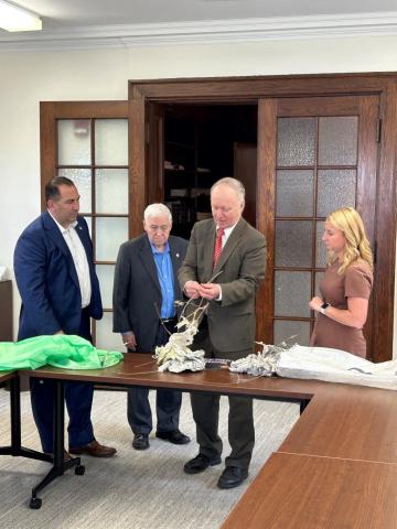 Legislators are shown how lanterns are harmful to area farmers